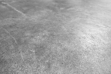 Fototapeta premium Concrete floor background for placing objects with free space for text. Sloping view of the gray floor texture. Soft focus