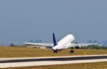 Fototapeta na wymiar Civil Aircraft lands at Malta Airport