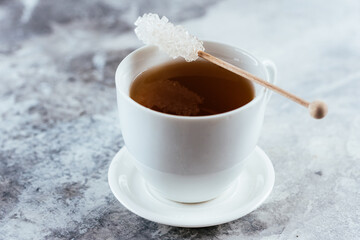 tea and sugar on a wooden stick