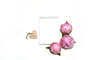 sheet for writing, pink peonies, wooden heart on a white background