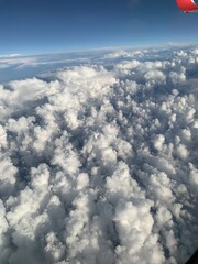 view of the clouds from the window of an airplane
