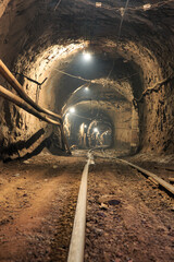 Narrow gauge railroad in the underground mine horizon. Technologies of mining of minerals by the...