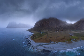 Rocks near sea in foggy weather