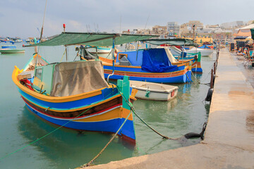 Fototapeta na wymiar Marsaxlokk fishing boats Malta - Raining