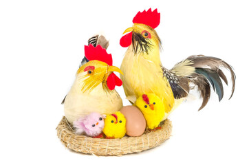Easter composition - hen, rooster and yellow chicks in the nest isolated on white background