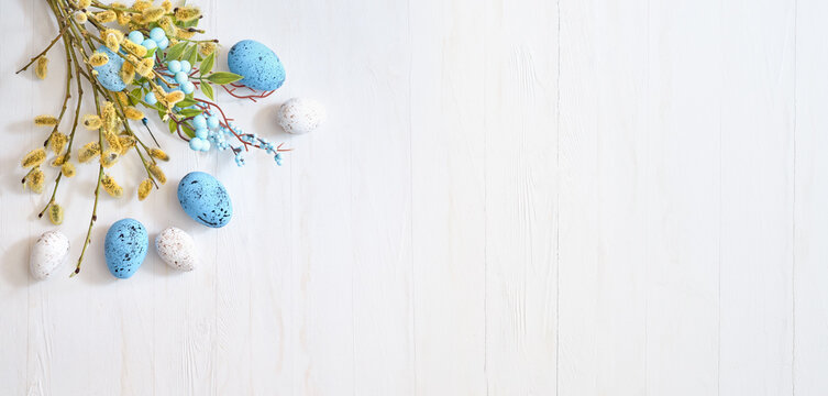 Willow branches and decorations, easter eggs on a light background. Happy easter flat lay concept
