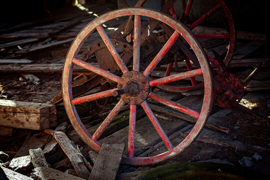 ancient red wooden wheel with spokes