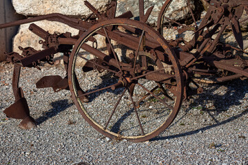 wheel of an old plough made of iron