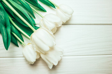 Tulips on wooden background.In spring