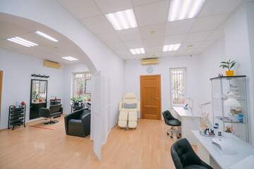 The interior of the nail salon without people. A bright, modern salon for the care of nails