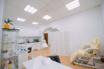 The interior of the nail salon without people. A bright, modern salon for the care of nails