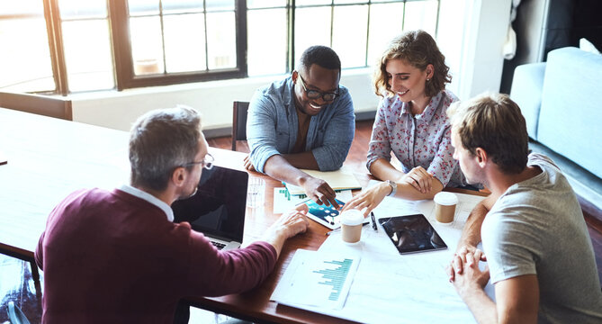 They come up with the most innovative ideas. Shot of a creative team having a brainstorming session in the boardroom.