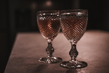 Rose wine. Two glasses of wine on a table. Wine for two.