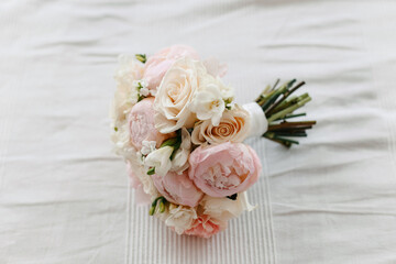 Bouquet of peonies and roses on white.