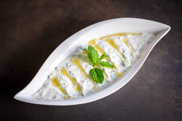 Haydari is a type of yogurt made from certain herbs and spices, combined with garlic. Turkish cuisine.
