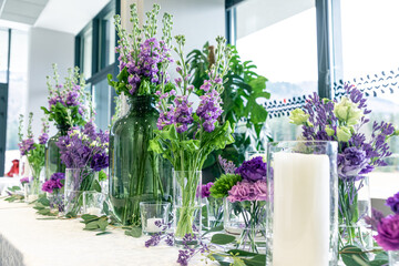 Purple and violet wedding flower arrangements, made out of carnations lisianthus and matthiola flowers. 