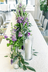 Purple and violet wedding flower arrangements, made out of carnations lisianthus and matthiola flowers. 