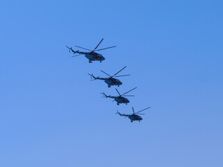 Fototapeta na wymiar Russia, St. Petersburg - June 24, 2020: Russian military helicopters Mi-8 of the Russian Air Force in flight at the Victory Parade in World War II.