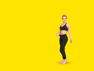 Fototapeta na wymiar Beautiful fitness woman shows abdominal muscles.