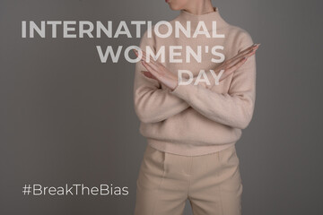 Break the bias symbol of woman's international day. Crossed hands. Woman arms crossed to show...