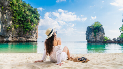 Happy traveler woman relaxing on vacation beach joy nature view scenic landscape Hong island Krabi,...
