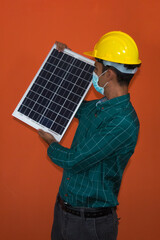 Solar Worker isolated in orange background.