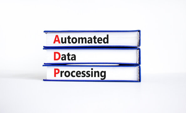 ADP automated data processing symbol. Concept words ADP automated data processing on books on a beautiful white table, white background. Business and ADP automated data processing concept. Copy space.
