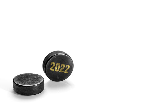 Two hockey pucks