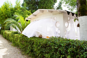 summer gazebo with white curtains