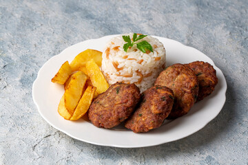 Traditional Turkish food; dry meatballs or inegöl meatballs with potatoes (Turkish name; Kuru kofte)