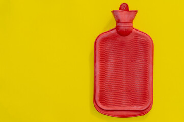 Red rubber heat water on yellow background.