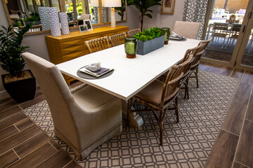 Dining Area With Eight Chairs On Decorator Rug