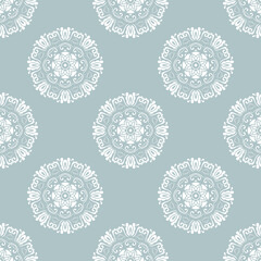 Floral ornament. Seamless abstract classic background with flowers. Pattern with repeating white round elements. Ornament for fabric, wallpaper and packaging