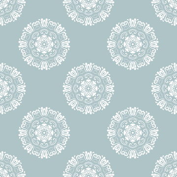Floral ornament. Seamless abstract classic background with flowers. Pattern with repeating white round elements. Ornament for fabric, wallpaper and packaging