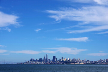 Naklejka premium Go to Page |Prev12345...11Next San Francisco skyline under blue sky with some clouds in early August of 2021