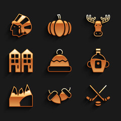 Set Beanie hat, Acorn, Ice hockey sticks and puck, Maple syrup, Mountains, House, Moose head with horns and Native American Indian icon. Vector