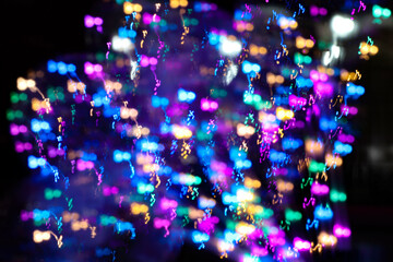 multiple light colors blurred in dark backrgound