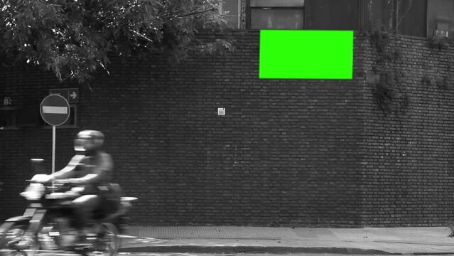 Blank Billboard or Billboard with Green Screen on Brick Wall of a House in Argentina. Black and White Tone. You can replace green screen with any image or video with “Keying” (Chroma Key) effect.