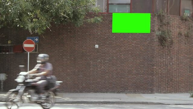 Blank Billboard or Billboard with Green Screen on Brick Wall of a House in Argentina. You can replace green screen with any image or video with “Keying” (Chroma Key) effect in Adobe After Effects.