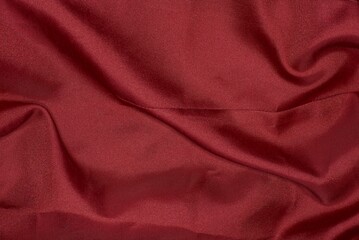 red texture from a piece of crumpled fabric on old clothes