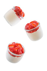 Greek yogurt with strawberries in a glass on a white isolated background