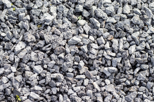 Grey stones on ground, textured background, outdoors and natural.