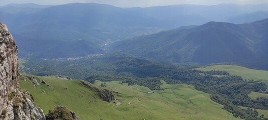 Fototapeta na wymiar Panorama of the mountains and green hills
