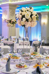 Beautiful table setting for a wedding celebration in a restaurant.