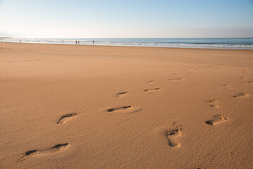 Footprints in the sand on the beach at sunrise, Barbate, Cadiz, Andalusia, Spain