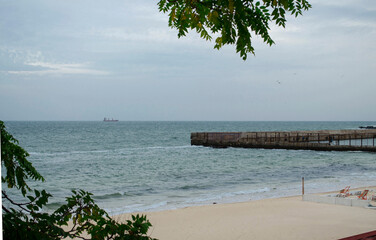 Tranquil waters of the blue sea. The beach next to it is a perfect place for meditation and life retrospection.