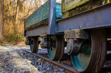 Fototapeta na wymiar Old weathered wooden railway carriage on a track of a former marshalling yard.