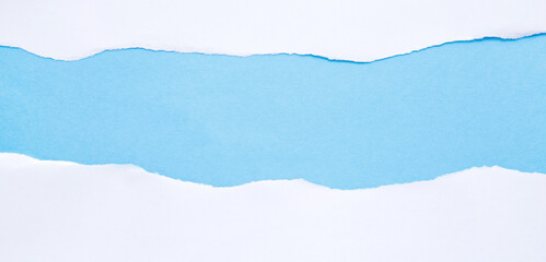 Torn white paper on blue background with space for text, banner