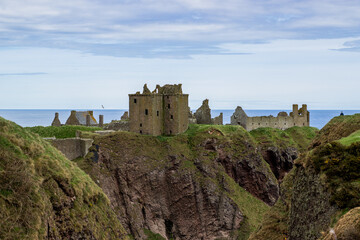 A Beautiful view of Dunnottar Castle near Stonehaven, Aberdeenshire, Scotland, UK in cloudy spring weather
