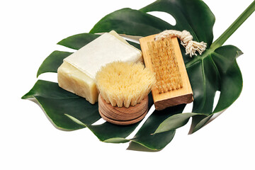 Zero waste concept, sustainable lifestyle. plastic free natural eco bamboo brush,  soap, Bath accessories made of natural material on Monstera leaf